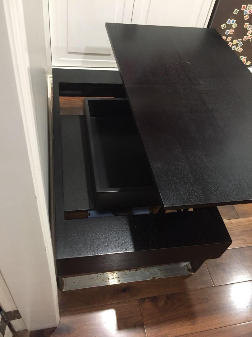 Preloved Coffee table (Category: Tables & Sets) located in Quezon City. Submitted by kassielim (Listing ID 246213337, Image 2). Description: Beautiful black wood coffee table with pull out top to reveal a small cabinet inside for magazines or remote controls etc. Never been used. Original price was 13k Dimensions (inches) Height 33.5” (15” wooden part and 18.5” metal legs) Length 110.5” Depth 60.5” RFS: impulse buy Material: black wood with metal