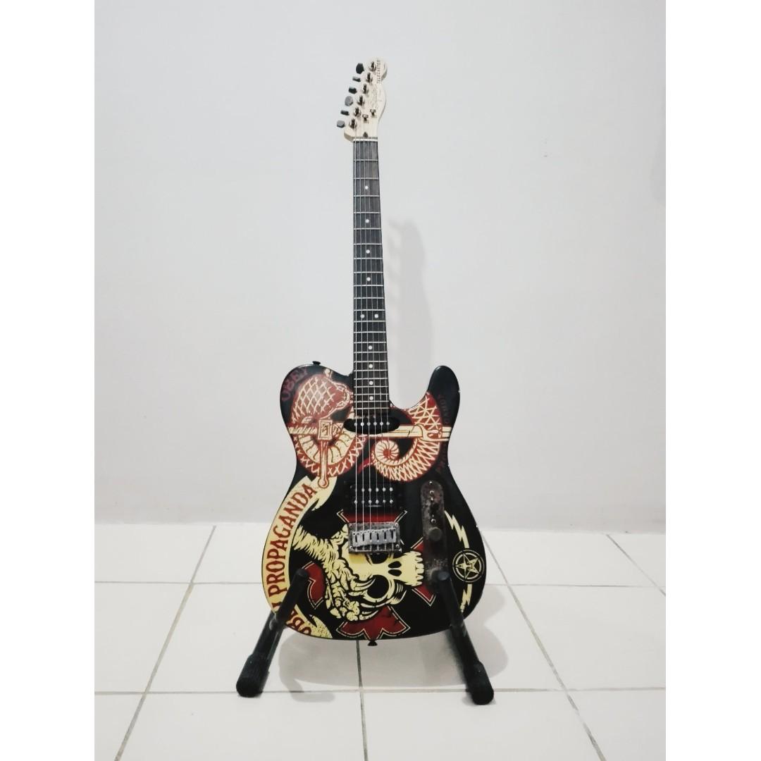 Squier by Fender Obey Telecaster (Category: Musical Instruments) located in Manila. Submitted by mywardrobeonsale (Listing ID 246237243, Image 1). Description: This Squier Telecaster Electric Guitar with graphics by artist Shepard Fairey is a hot, high-powered Telecaster equipped with a bridge humbucker and a single coil neck pickup. Oxidized worn hardware gives this guitar the look of a veteran. Features: - Agathis body - Maple neck with rosewoo