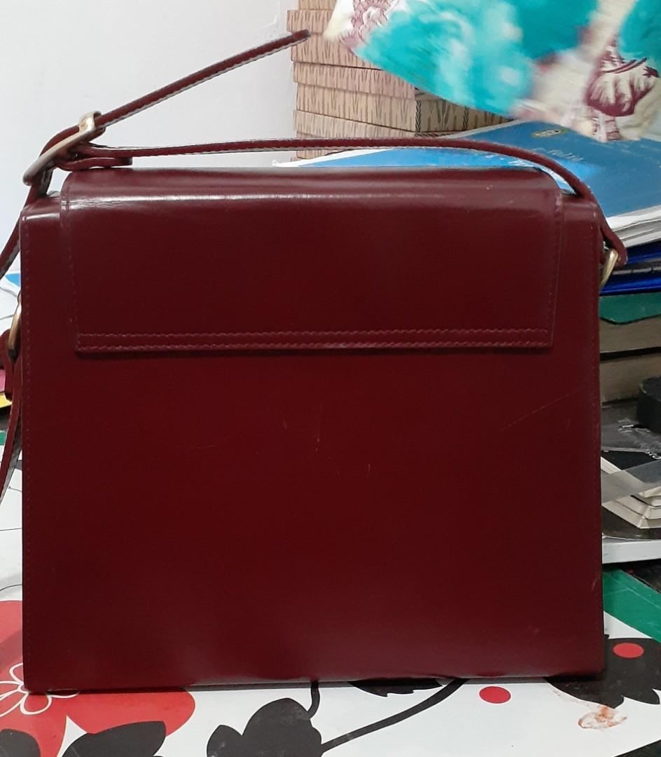 Bonia Sling Bag (Category: Luxury Bags & Wallets) located in Makati City. Submitted by fiestypam (Listing ID 246596351, Image 2). Description: Preowned. Just got this today. Not my sort of bag I realized. Vintage boxy leather bag with tarnished hardware. Lightweight. Adjustable strap. Measurements are on the photos..
