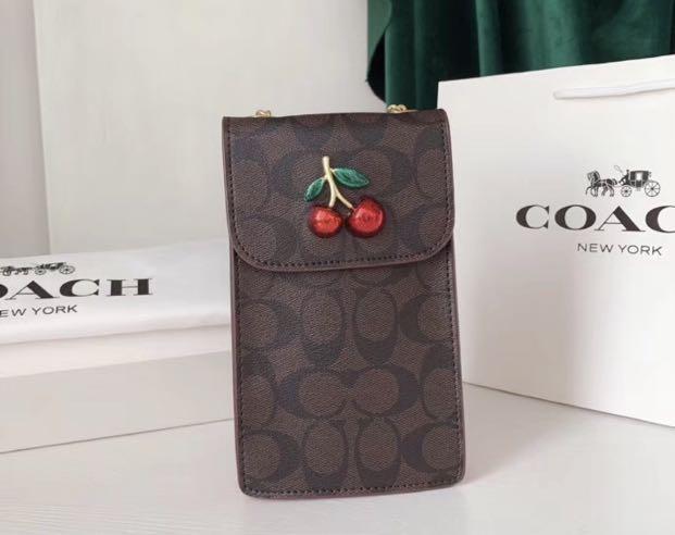 Coach iphone sale clutch