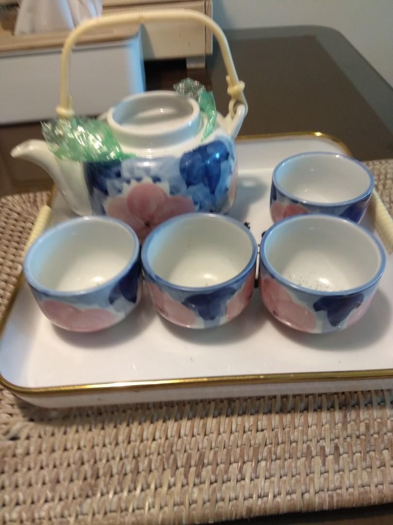 Tea Set (Category: Coffee & Tea Tableware) located in Singapore. Submitted by litrinlay (Listing ID 247243208, Image 2). Description: 1) tea set (new) $10 2)6 PCs rice bowl from CK Tang bought for house warming used only.$3/pc 3) 6 pcs plate from C K Tang @$3/pc (used once during house warming) To collect at block 266A punggol emerald..