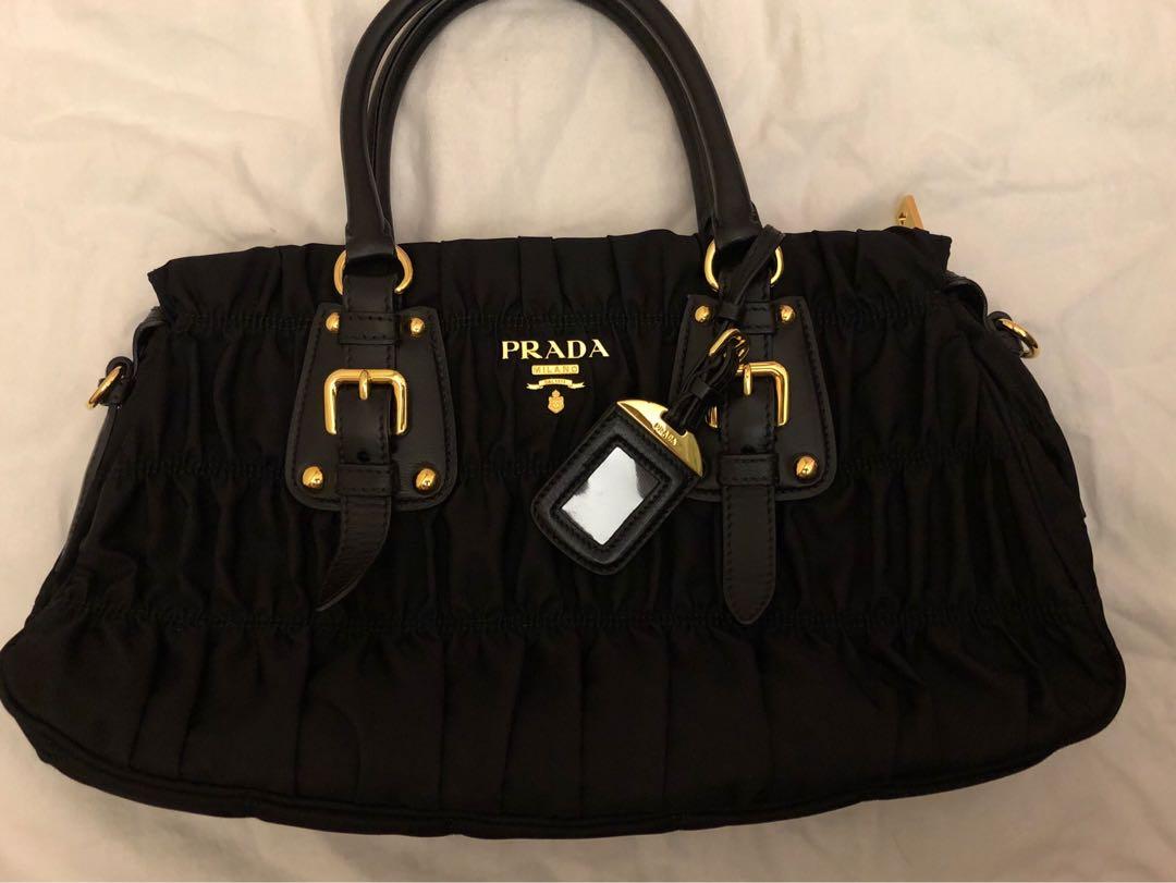black prada bag with gold hardware