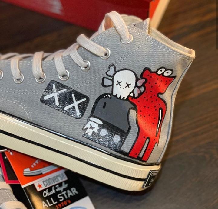 Harga converse x top kaws