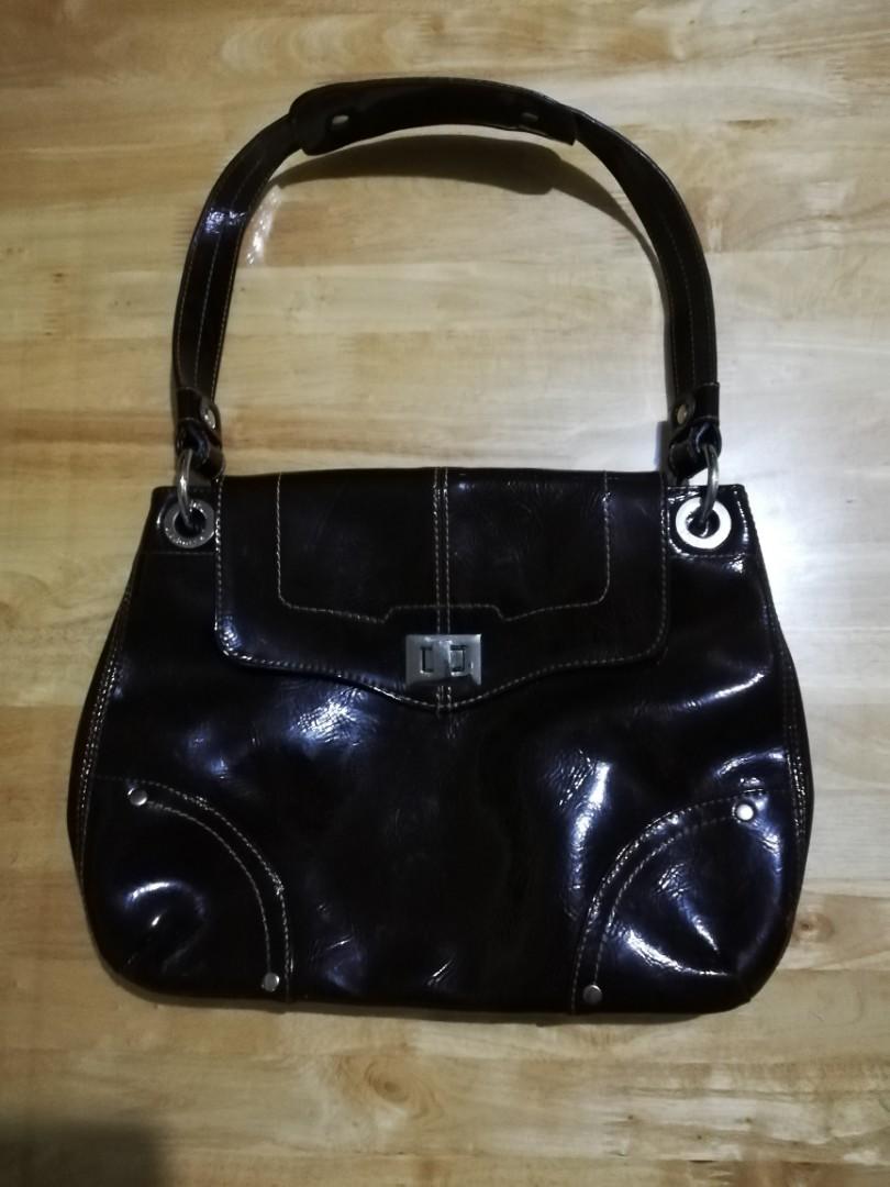 Liz Claiborne Brown Glossy Bag (Category: Purses & Pouches) located in Makati City. Submitted by closet_stuff (Listing ID 247799078, Image 1). Description: Barely used Mode of payment BPI.
