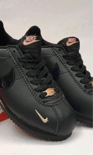 rose gold and black nike cortez