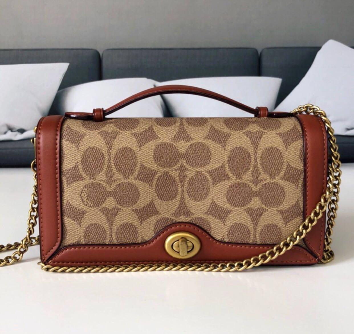 Riley chain clutch store in colorblock signature canvas