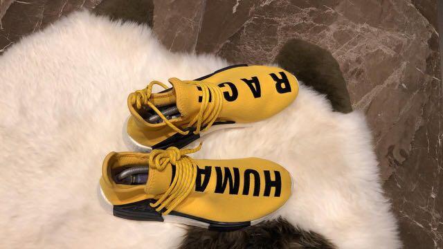 human race yellow sneakers