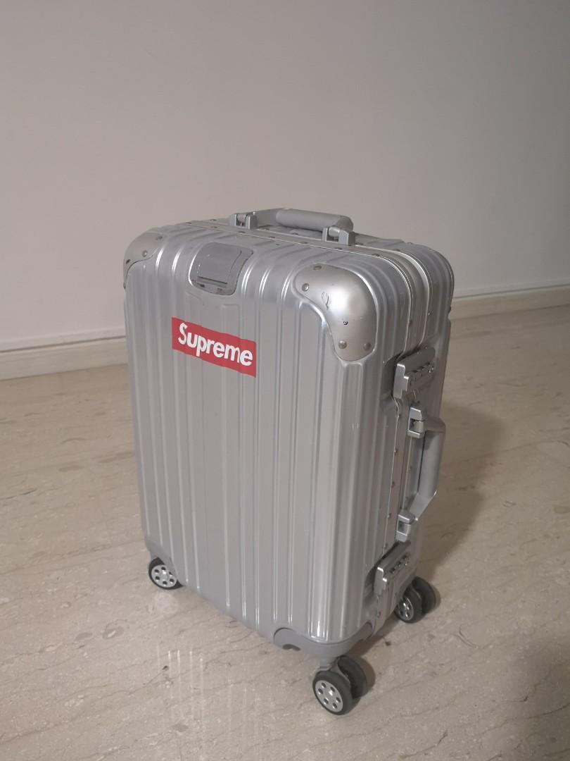 Supreme sticker 20 inch silver cabin size luggage