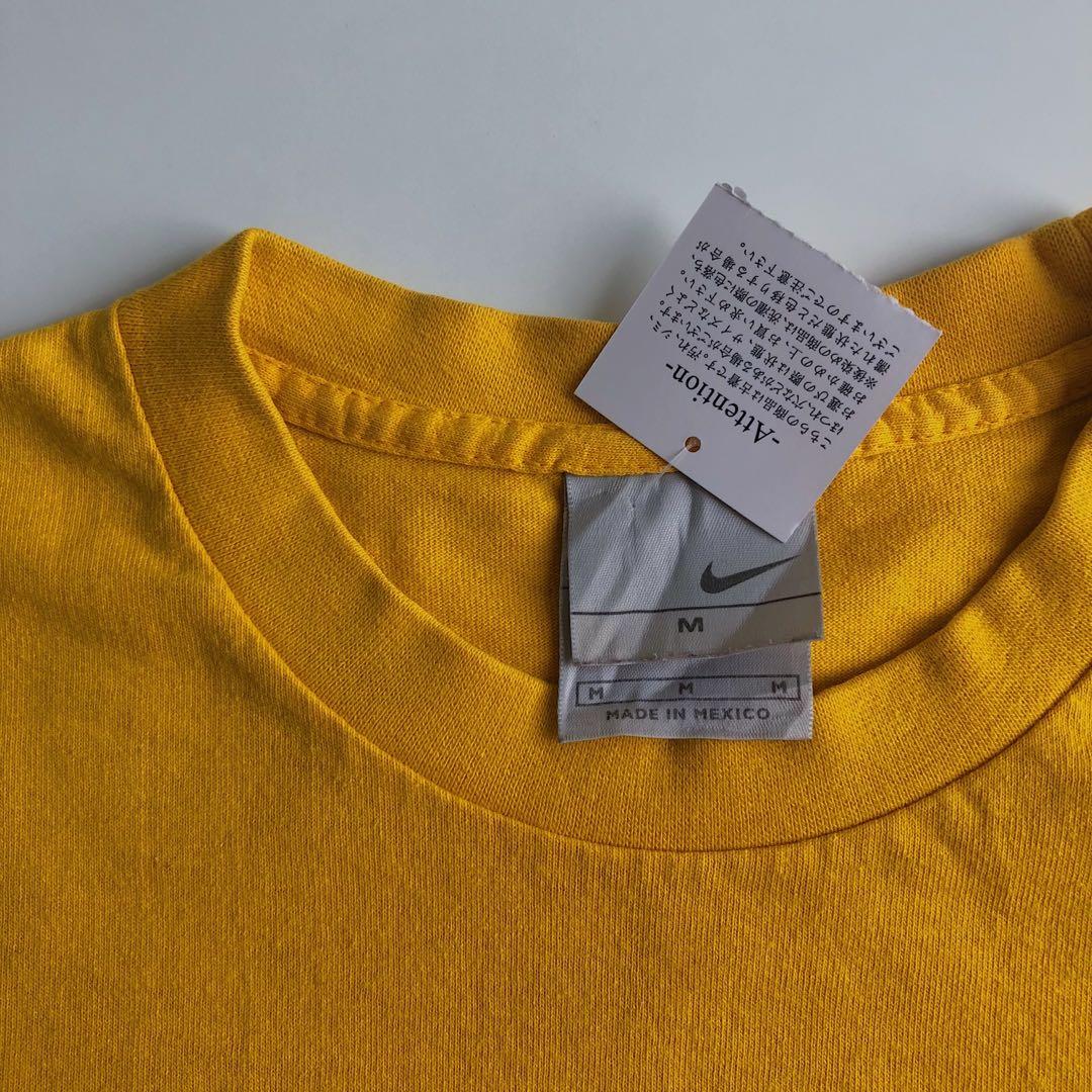 mustard yellow nike shirt