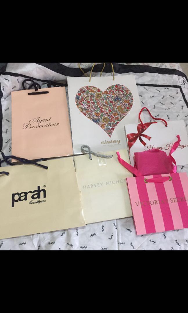 used assorted signature paper bags (Category: Tote Bags) located in San Antonio. Submitted by fashion_enthusiast (Listing ID 250435771, Image 1). Description: medium Agent Provocateur paper bag Medium Sisley Paris paper bag small Harvey Nichols paper bag Medium Duty Free Holiday paper bag Medium Parah boutique paper bag small VS paper bag .