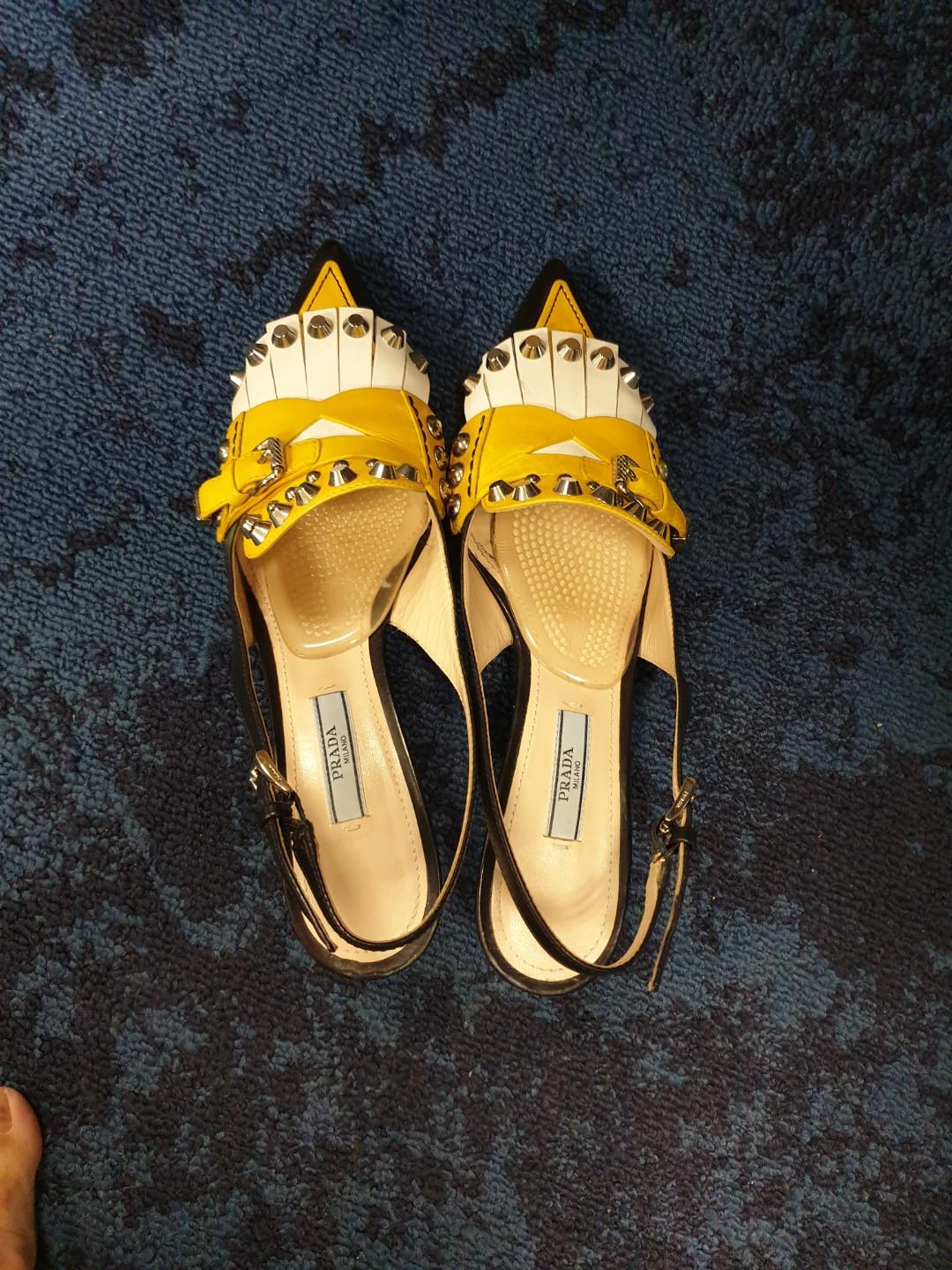 yellow and black pumps