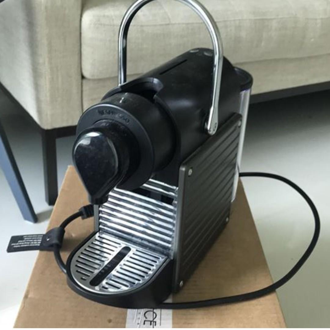 Nespresso Pixie (Category: Coffee Machines & Makers) located in Singapore. Submitted by teriaa (Listing ID 251226172, Image 2). Description: Retails for up to $320. Not used since new flat has coffee machine. Portable, light. No complaints. Regularly de-scaled. Comes with a FREE de-scaling kit (1 of the 2 kits left from my last purchase). One plastic bar missing (see second photo) but doesn't affect coffee machine usage/ performance. SPECIFICATIO