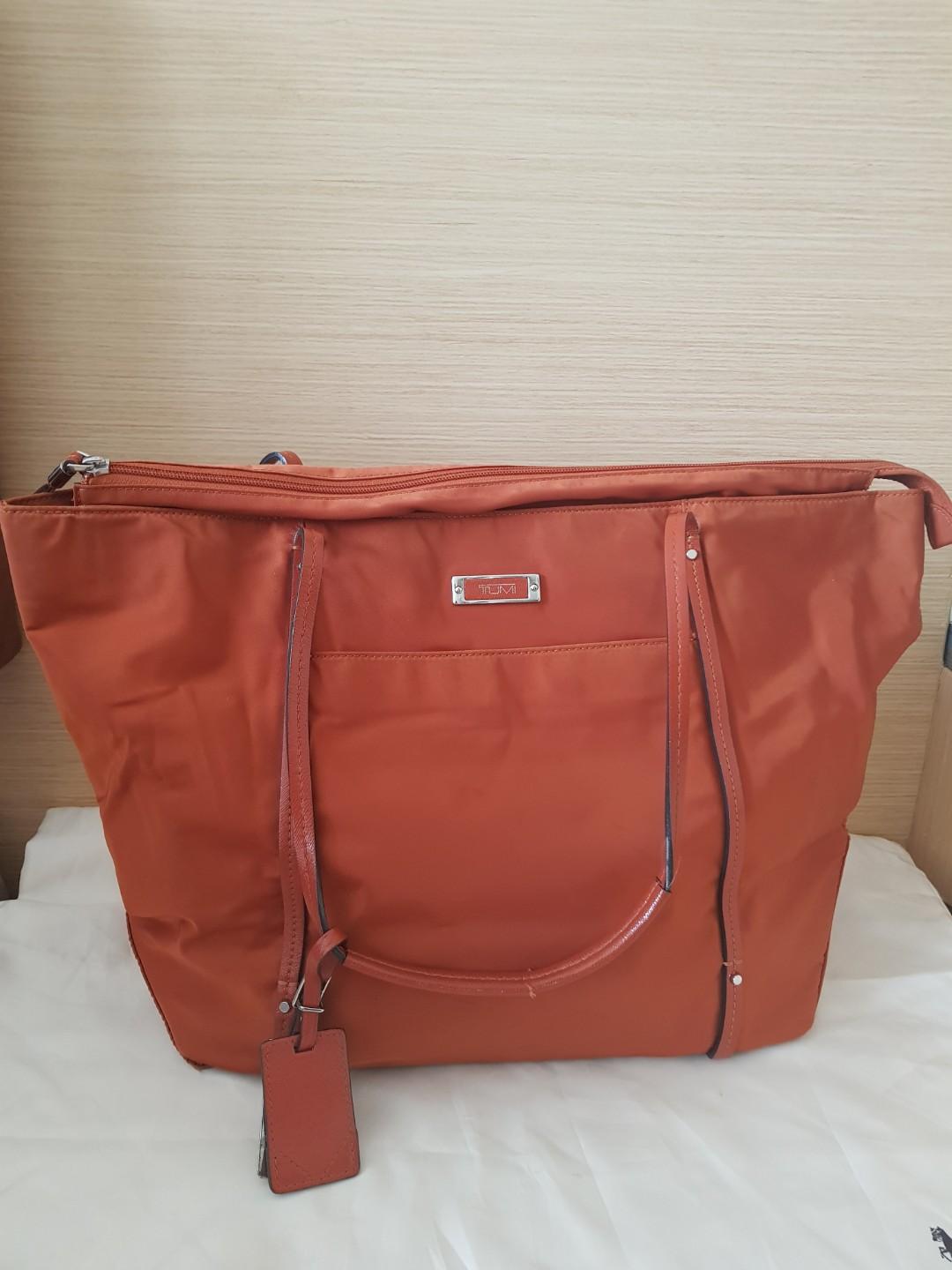 tumi orange bag