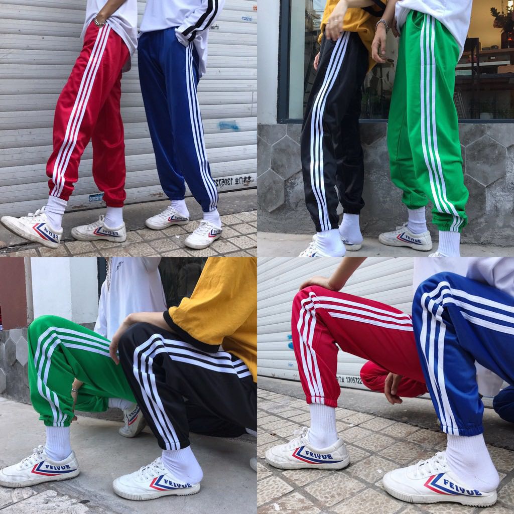 blue adidas pants with green stripes