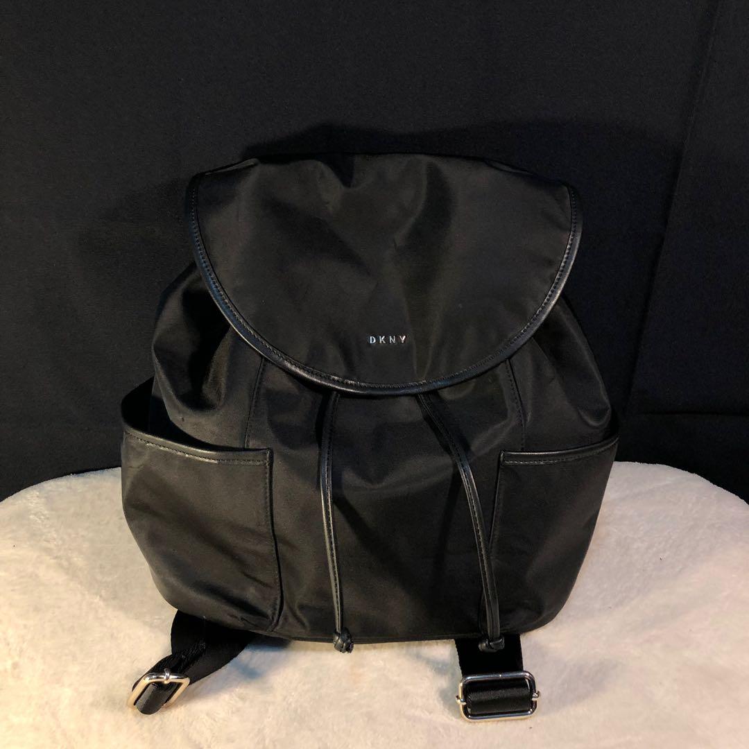 dkny nylon drawstring mini backpack Giania Bag in Black R13KEP82  The back and adjustable shoulder straps are padded with jacquard logos on the straps and there is a useful carry handle on the top. Dkny Black IMPRESSIONIST Range Logo