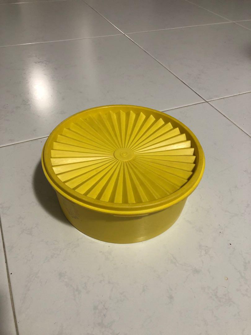 Tupperware Container (Category: Food Organisation & Storage) located in Singapore. Submitted by warehouseraider (Listing ID 252534274, Image 1). Description: Yellow round container Good for cookies.