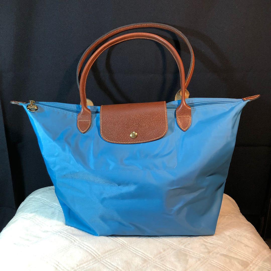 AUTHENTIC Longchamp Le Pliage in Blue (Flawed inside) (Category: Luxury Bags & Wallets) located in San Juan City. Submitted by flyboutique (Listing ID 252820695, Image 1). Description: -Condition/ Flaws: Exterior is in EXCELLENT condition. Flaw is in the inside of the bag: needs restoration/ cleaning spilled lip stains/tints, dirt that’s why were selling it low -Inclusions: None Perfect for shopping ❤️ ➖Send us a message or sms/viber 0927-136-180