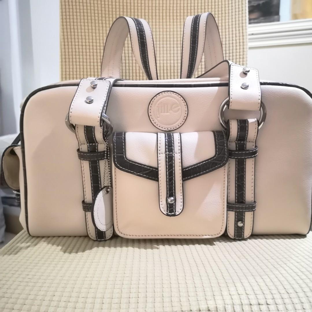 white luggage with tan trim