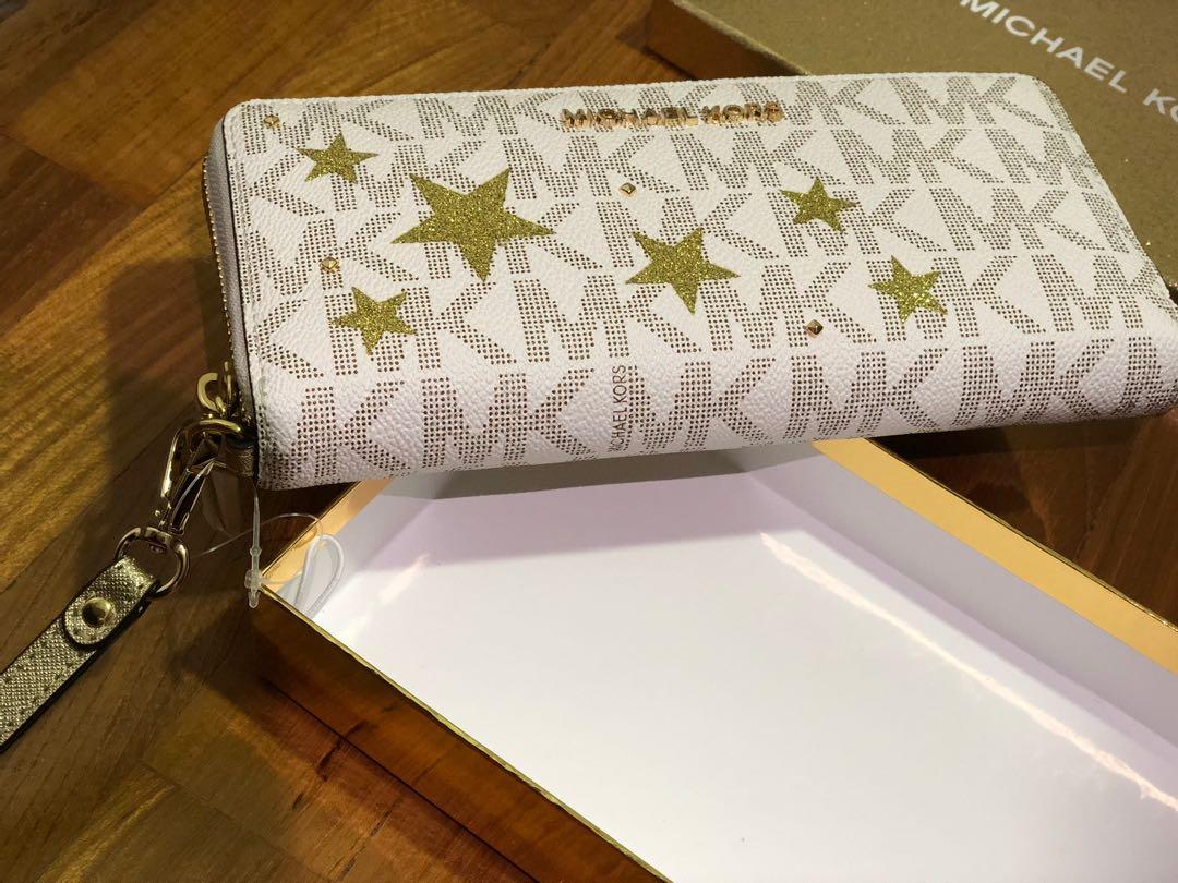 BNIB Authentic Michael Kors Illustrations Gold Star Travel Wallet, Women's  Fashion, Bags & Wallets, Wallets & Card Holders on Carousell