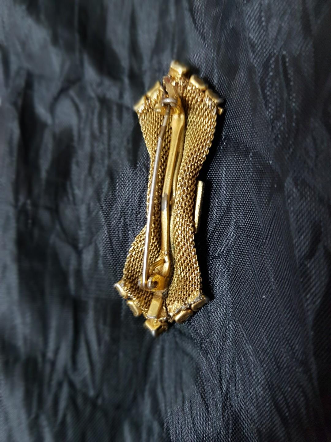 Vintage Gold Toned Bow Brooch (Category: Brooches) located in Mandaluyong City. Submitted by encardisu (Listing ID 253164842, Image 3). Description: This is a vintage gold toned brooch in a mesh bow design. Got some wear on it as shown on photos so please manage your expectations. Sure buyers may send me a message for additional photos. Buyer shoulders the shipping..