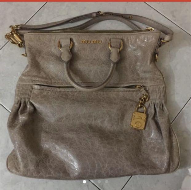 Miu Miu Distressed Leather Sling Bag, Women's Fashion, Bags & Wallets