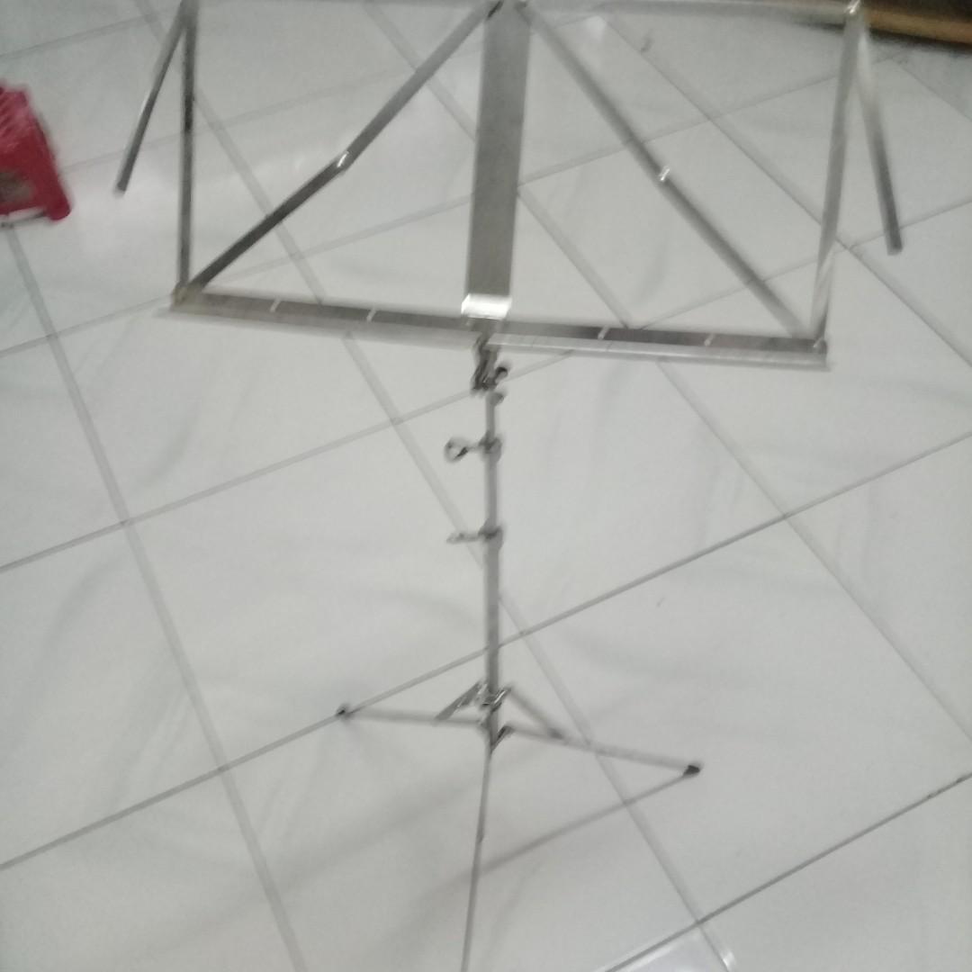 Music Sheet Stand (Category: Musical Instruments) located in Manila. Submitted by cristev.cristev (Listing ID 253705851, Image 1). Description: Music sheet stand, aluminum alloy or stainless steel, no brand, made in Taiwan, can reach 50" high, collapsible.