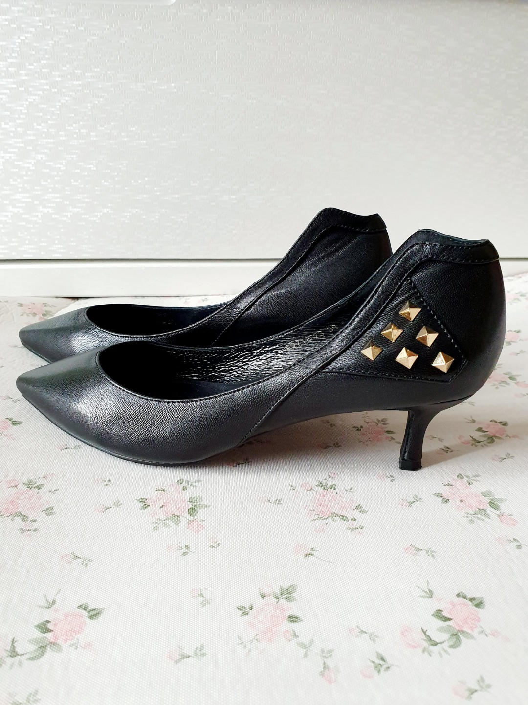 black heels with gold studs