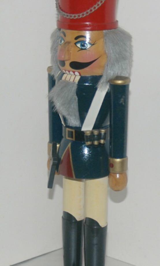Wooden Nutcracker Soldier With Side Piston 14 Inch Tall (Category: Vintage Collectibles) located in Quezon City. Submitted by inxskolexion (Listing ID 253607619, Image 2). Description: Wooden nutcracker soldier with side piston. Height 14 inches. Vintage collectible from 1995. Hand made and hand painted in green top. Red top hat adorn with medallion and chain. In very good aesthetic condition. The mouth do open with a wooden lever at the back, an