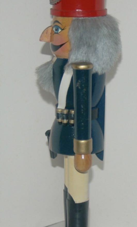 Wooden Nutcracker Soldier With Side Piston 14 Inch Tall (Category: Vintage Collectibles) located in Quezon City. Submitted by inxskolexion (Listing ID 253607619, Image 3). Description: Wooden nutcracker soldier with side piston. Height 14 inches. Vintage collectible from 1995. Hand made and hand painted in green top. Red top hat adorn with medallion and chain. In very good aesthetic condition. The mouth do open with a wooden lever at the back, an