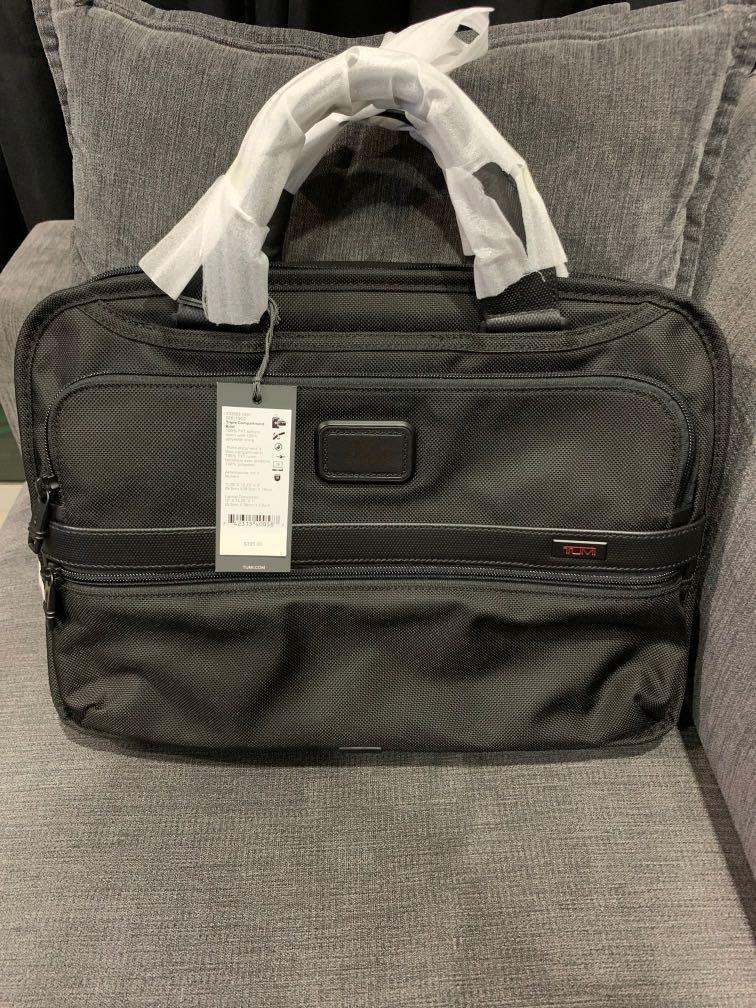 Triple compartment brief online tumi