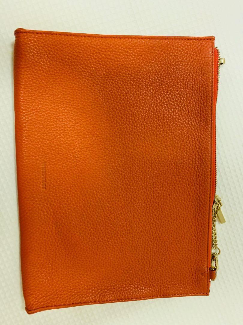 orange and gold clutch bag