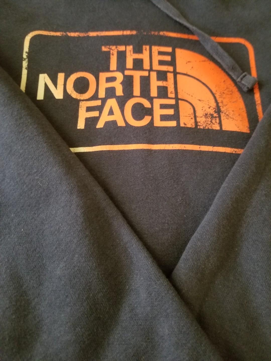 The North Face Hoodie (Category: Coats, Jackets and Outerwear) located in Paranaque City. Submitted by politzki (Listing ID 254904885, Image 2). Description: Navy Blue w/ Orange Logo.