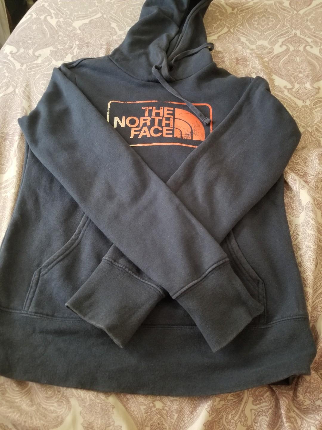 The North Face Hoodie (Category: Coats, Jackets and Outerwear) located in Paranaque City. Submitted by politzki (Listing ID 254904885, Image 1). Description: Navy Blue w/ Orange Logo.