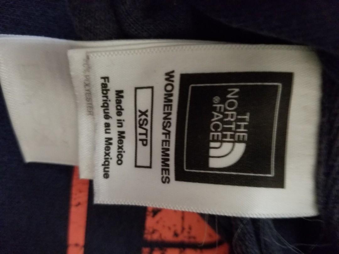 The North Face Hoodie (Category: Coats, Jackets and Outerwear) located in Paranaque City. Submitted by politzki (Listing ID 254904885, Image 3). Description: Navy Blue w/ Orange Logo.