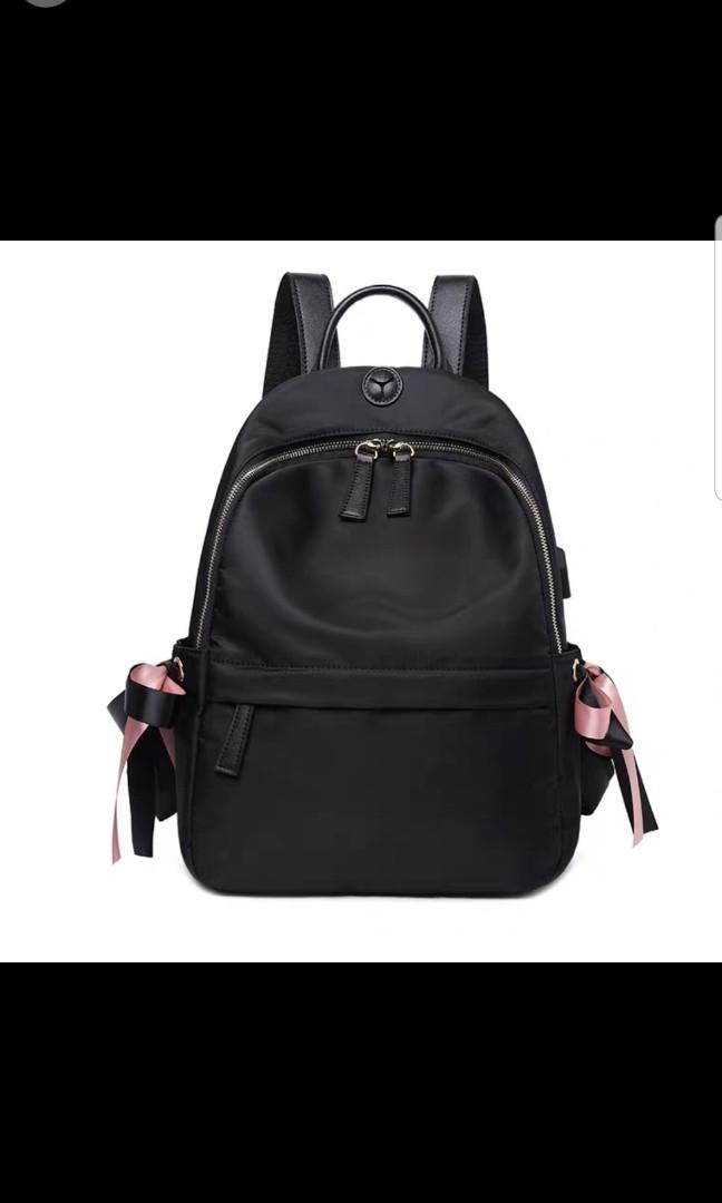 black and white pink backpack