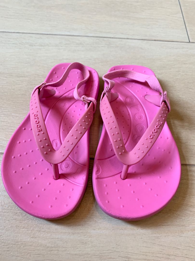 crocs pink flip flops