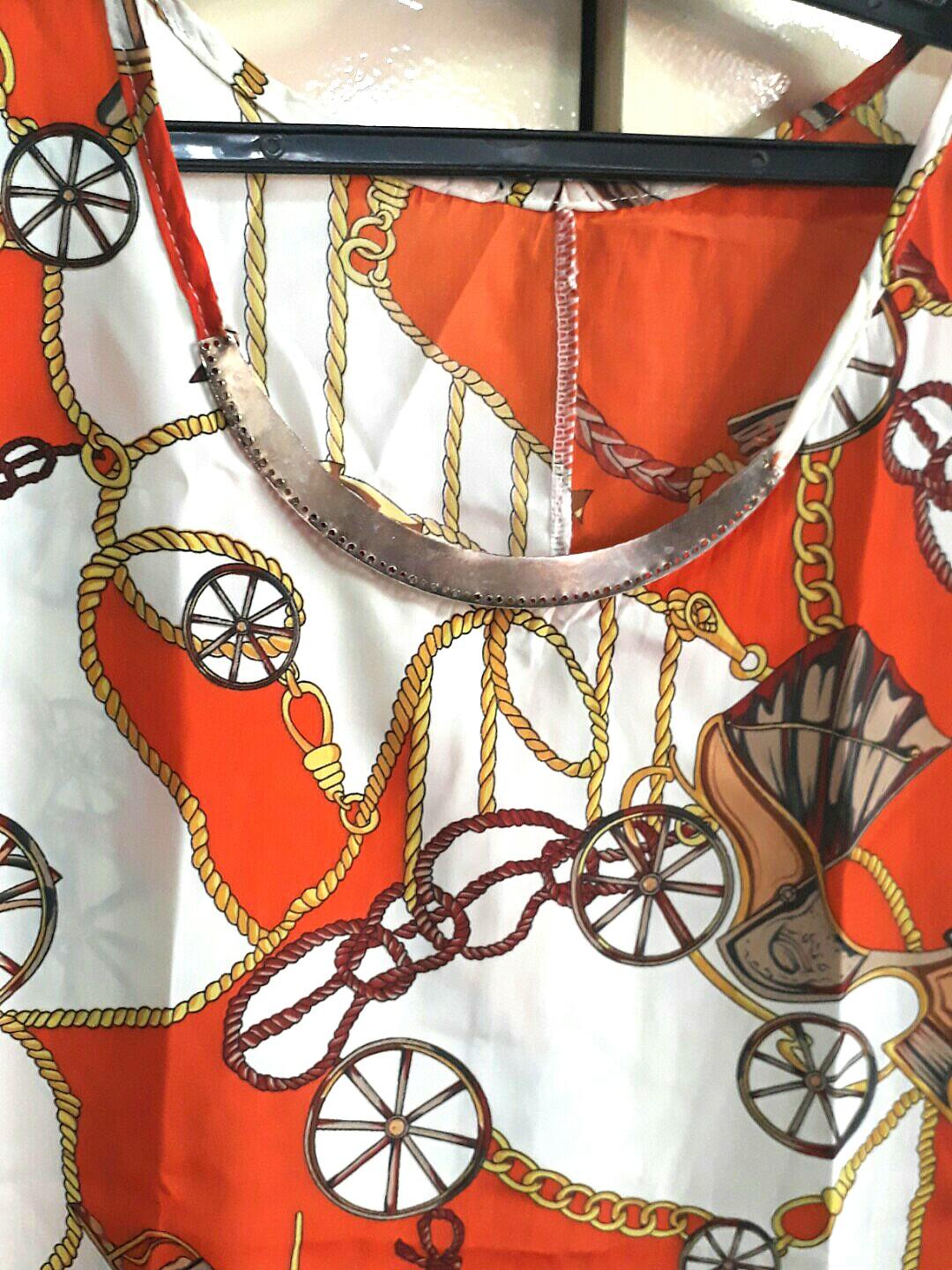 Fancy top w/ metal plate necklace (Category: Others Tops) located in Paranaque City. Submitted by dearmissy (Listing ID 255896147, Image 2). Description: Bought from Bangkok :) smooth and flowy fabric..so comfortable to wear and as if there's a gold necklace attached in front :).