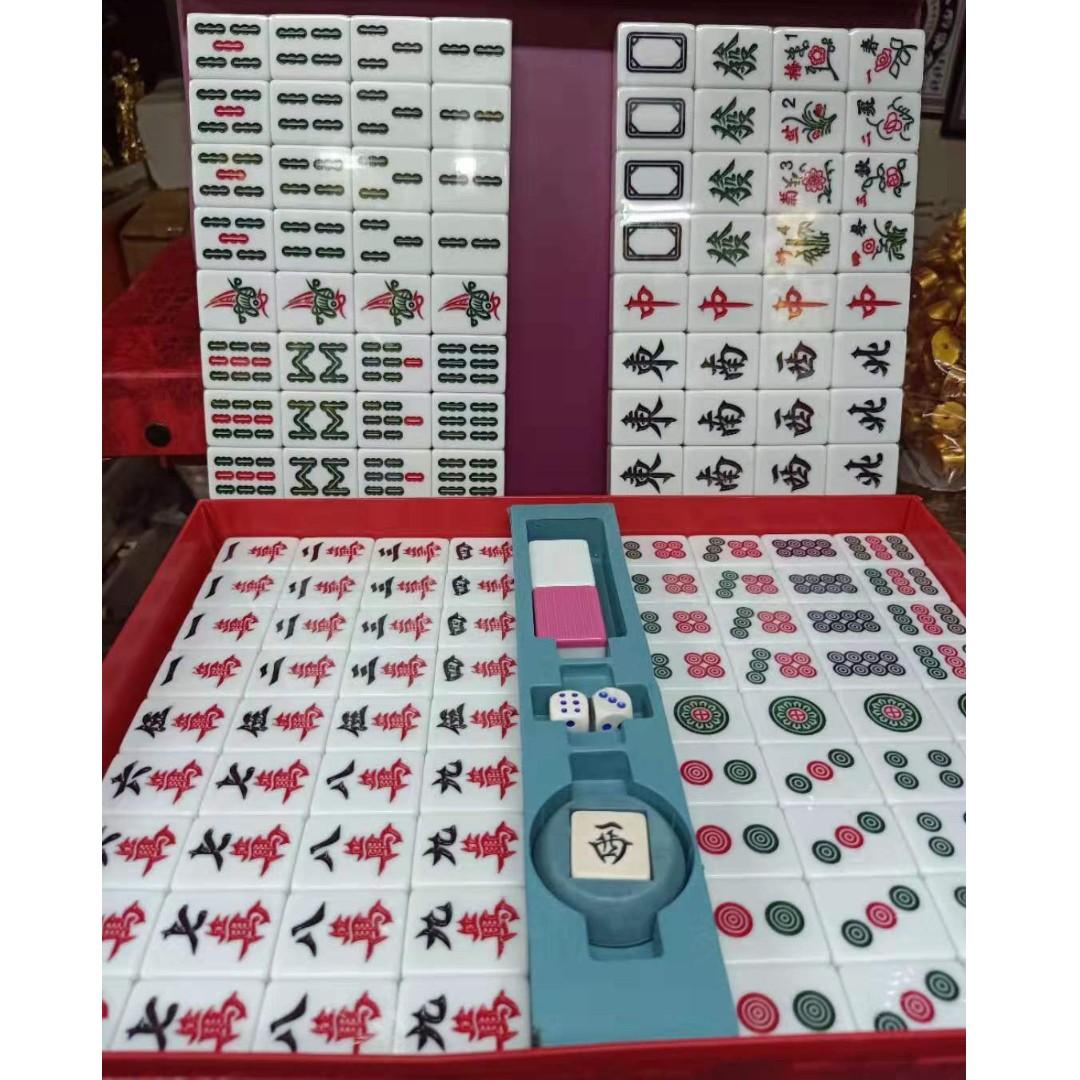 Mahjong Set Regular/ Standard Sized (Pink) (Category: Board Games & Puzzles) located in Manila. Submitted by julieggggg (Listing ID 255849371, Image 1). Description: Our Mahjong Set Regular/ Standard Size is composed of 144 tiles in each set in a red attache case. Made in Taiwan. The mahjong set's material is made from process solid ivory which is a durable base for players' long term use. If you prefer the mahjong set to have numbers in its char