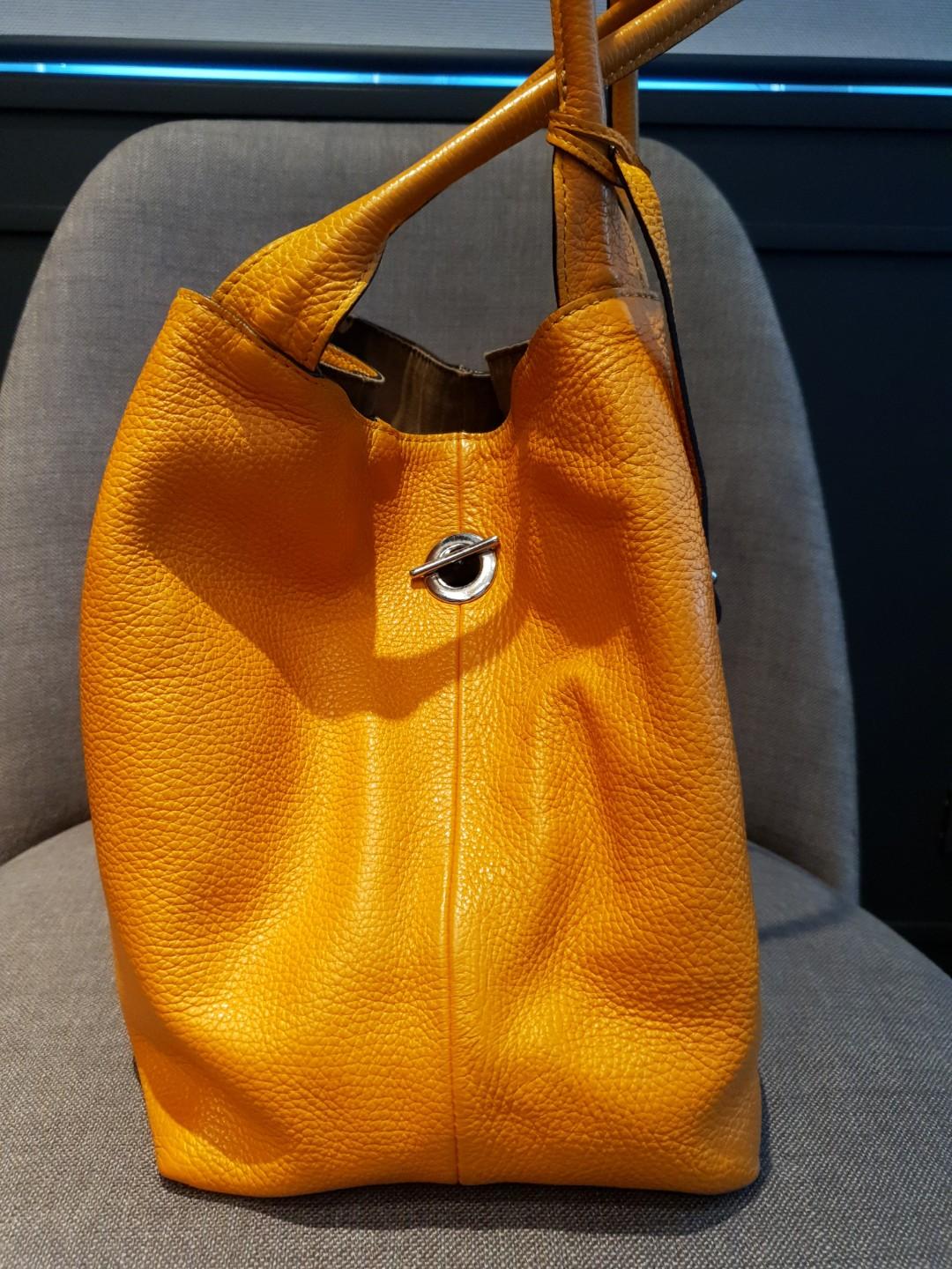 Mustard tote (Category: Tote Bags) located in Mandaluyong City. Submitted by secondipity111 (Listing ID 256068675, Image 3). Description: Rabeanco Alex large tote Classic collection Zipped pouch included Restored and conditioned by Doctor Leather Slightly used.