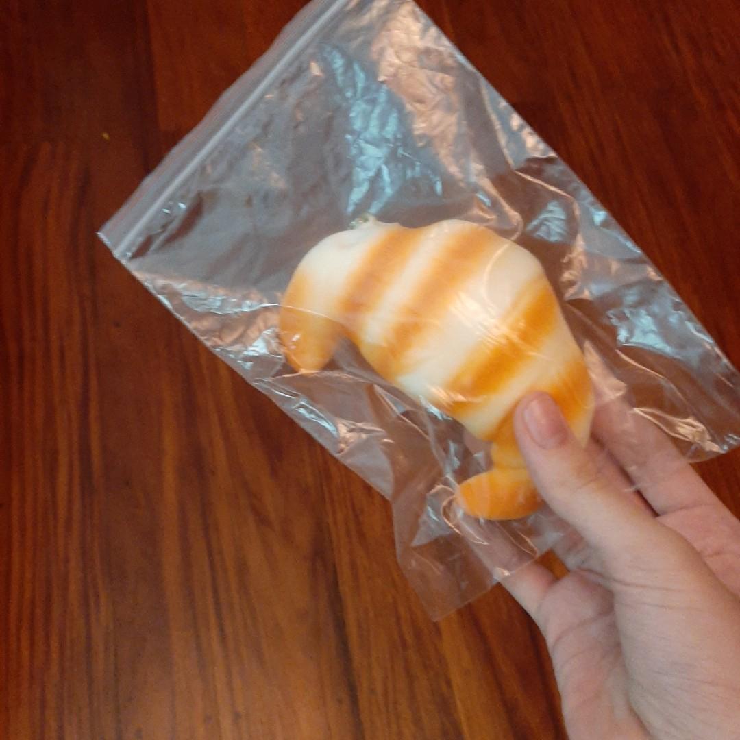 Croissant Bread Squishy Keychain (Category: Charms) located in Quezon City. Submitted by cncarousel (Listing ID 256575908, Image 1). Description: Soft ans Squishy! Stress relieving! Cute! 65 PHP for 1, 2 for 120 PHP.