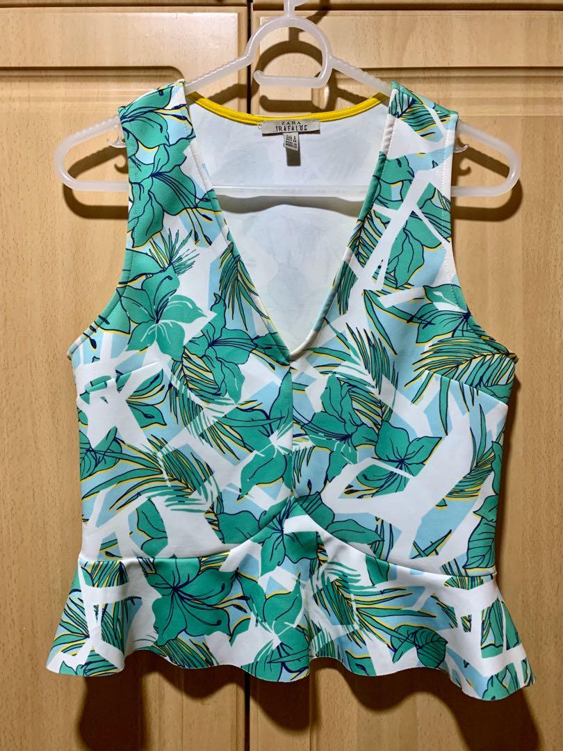 Zara tropical-print peplum top (Category: Blouses) located in Makati City. Submitted by _stepau (Listing ID 256776667, Image 1). Description: Used but in very good condition!.