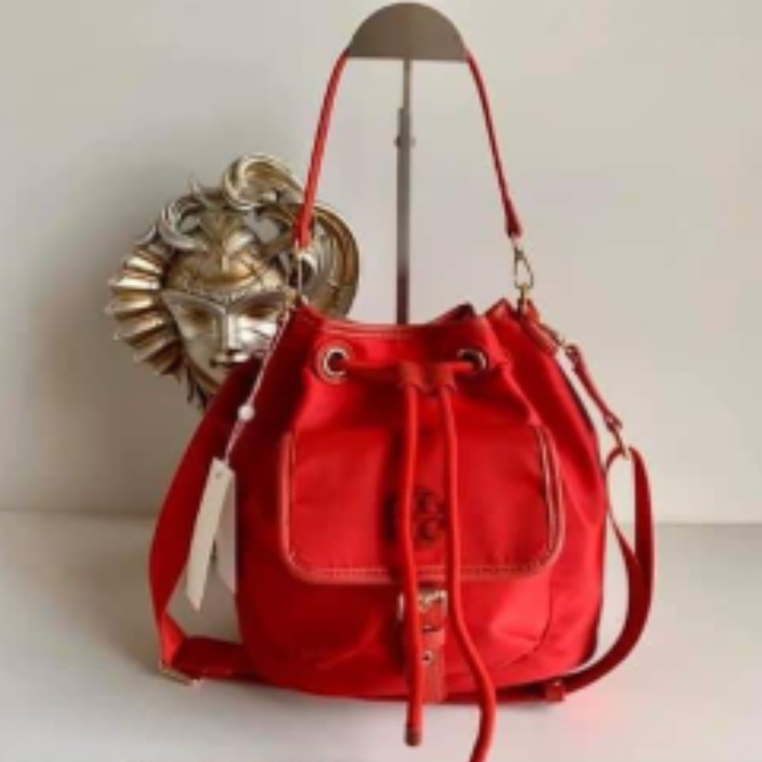 Tory Burch Scout Nylon Drawstring Bucket Bag - Red, Women's Fashion, Bags &  Wallets, Cross-body Bags on Carousell