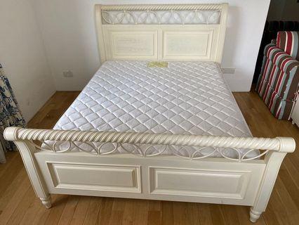 Queen-sized bed and mattress
