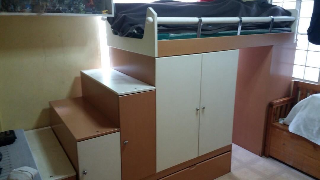 double deck bed with cabinet