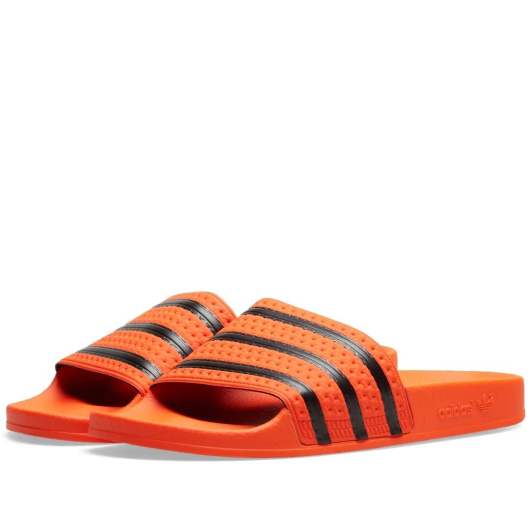 orange adilette slides