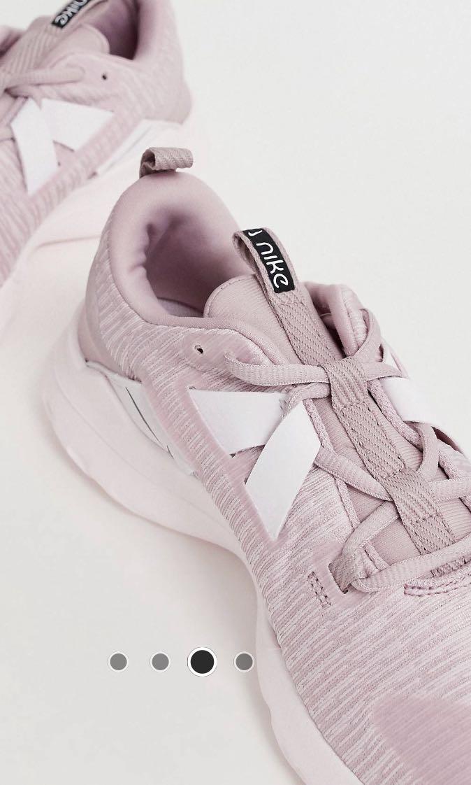 Nike Running Renew Arena Trainers in Pink size 5.5