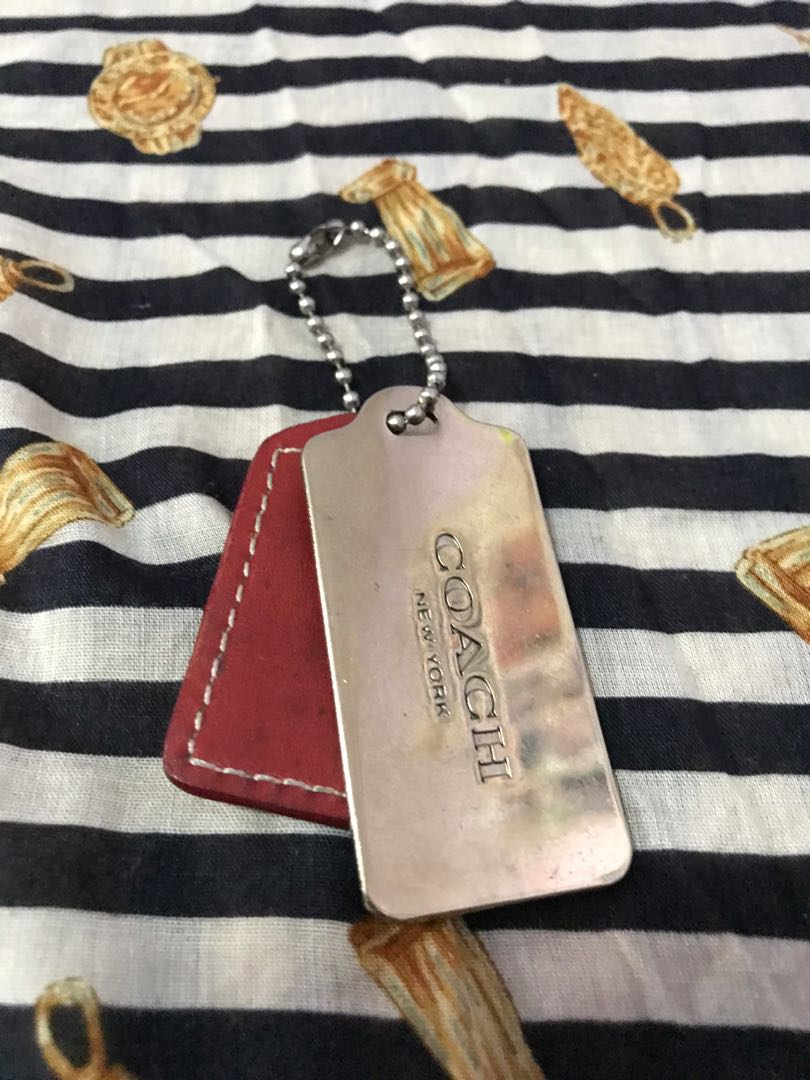 coach gold metal hang tag