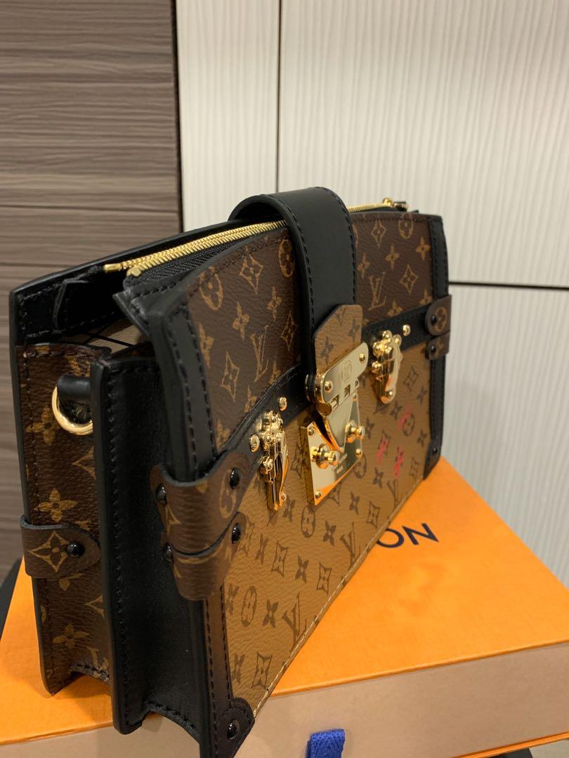 The New Louis Vuitton Trunk Clutch Tries to Make a Popular Clutch a Little  More Wearable - PurseBlog