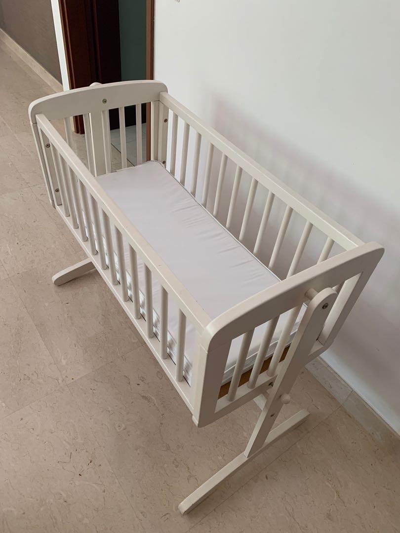 swinging crib mattress mothercare