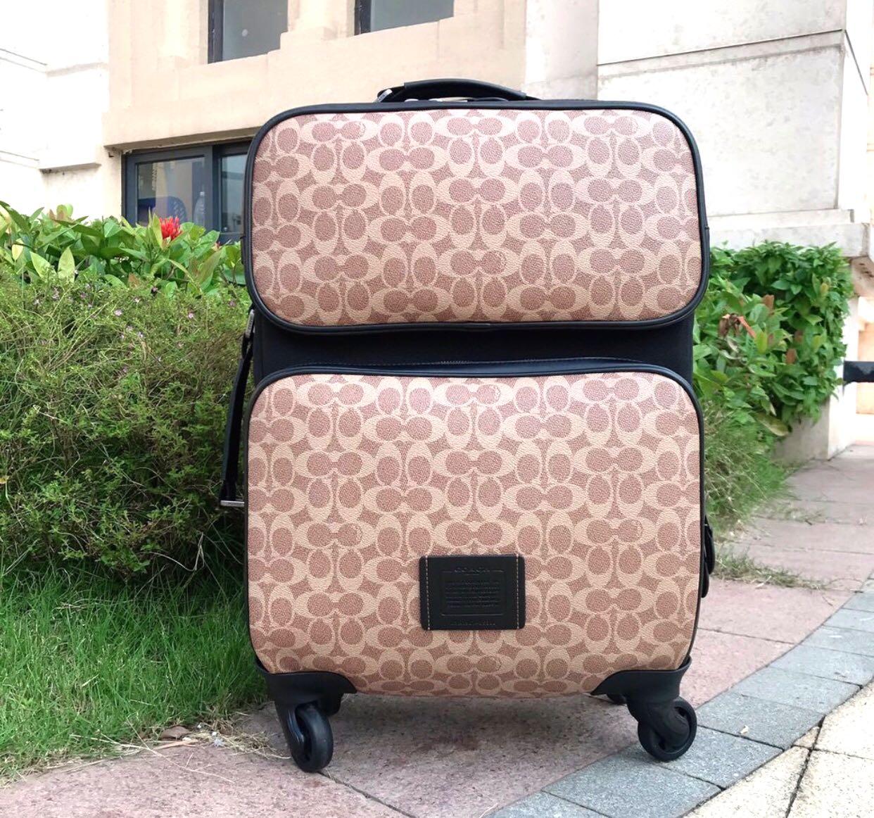 wheeled carry on in signature canvas
